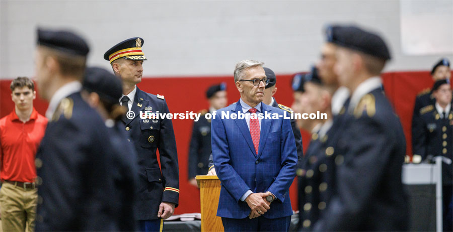 Chancellor Ronnie Green, center, along with Lieutenant Colonel Mark Peer. watch as the troops pass at the ROTC Joint Service Chancellor’s Review in Cook Pavilion. April 27, 2023. Photo by Craig Chandler / University Communication.