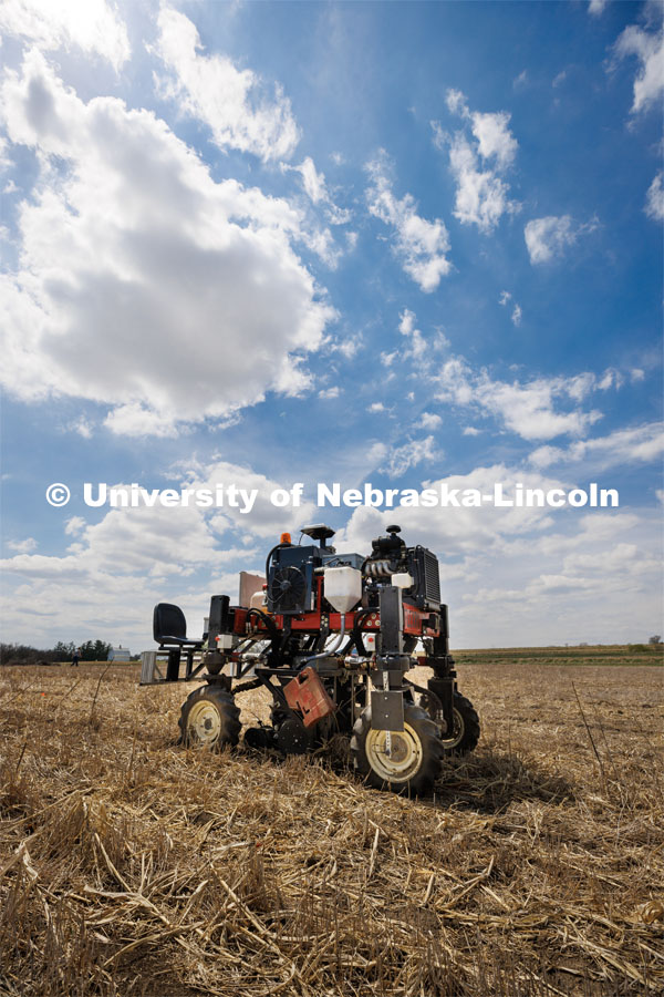 Flex-Ro, which first entered fields in 2019 to measure crop traits, can be controlled remotely and operated autonomously. It has been designed to be modular and reconfigurable, with different modes of steering ability available on the fly. Flex-Ro is a robotic planter based on Santosh Pitla’s tractor platform works its way through a field at the Rogers Memorial Farm east of Lincoln. April 27, 2023. Photo by Craig Chandler / University Communication.