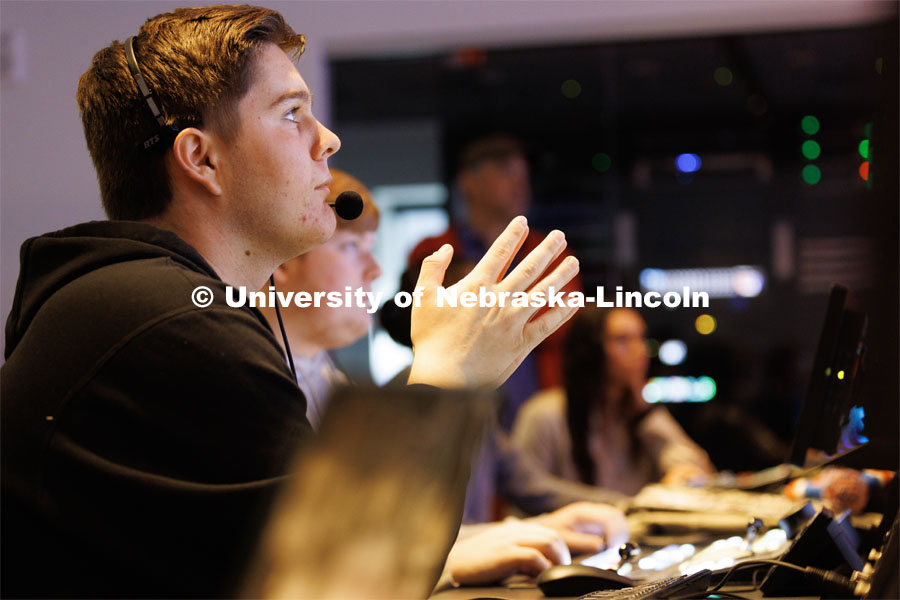 Logan Eby watches the control room monitors during the newscast. Students produce their Nebraska Nightly telecast in the new Don and Lorena Meier Studio. April 28, 2023. Photo by Craig Chandler / University Communication.