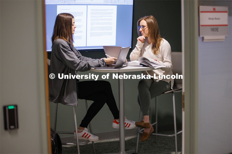 Students study together in a study room. College of Law photo shoot. April 28, 2023. Photo by Craig Chandler / University Communication.