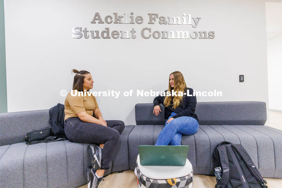 Students hang out in the Acklie Family Student Commons before class. College of Law photo shoot. April 28, 2023. Photo by Craig Chandler / University Communication.