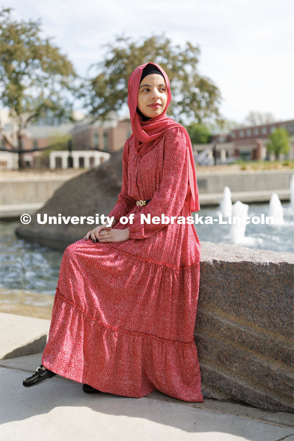 Sukaina Al-Hamedi, Husker Dialogue speaker is photographed outside the Nebraska Union by the Broyhill Fountain. May 10, 2023. Photo by Craig Chandler / University Communication.