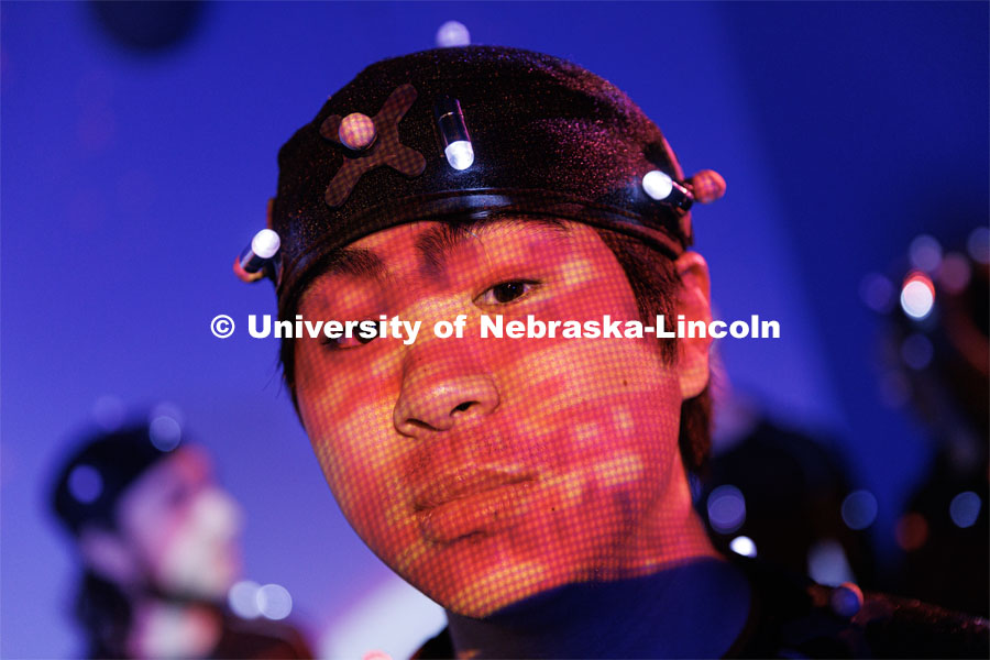 Students work in the Johnny Carson EMA MoCap (motion capture) lab wearing MoCap suits. The suits with their infrared sensors (round dots velcroed to the suit) allow a ring of cameras to turn their motion into animated characters on screen. May 17, 2023. Photo by Craig Chandler / University Communication.