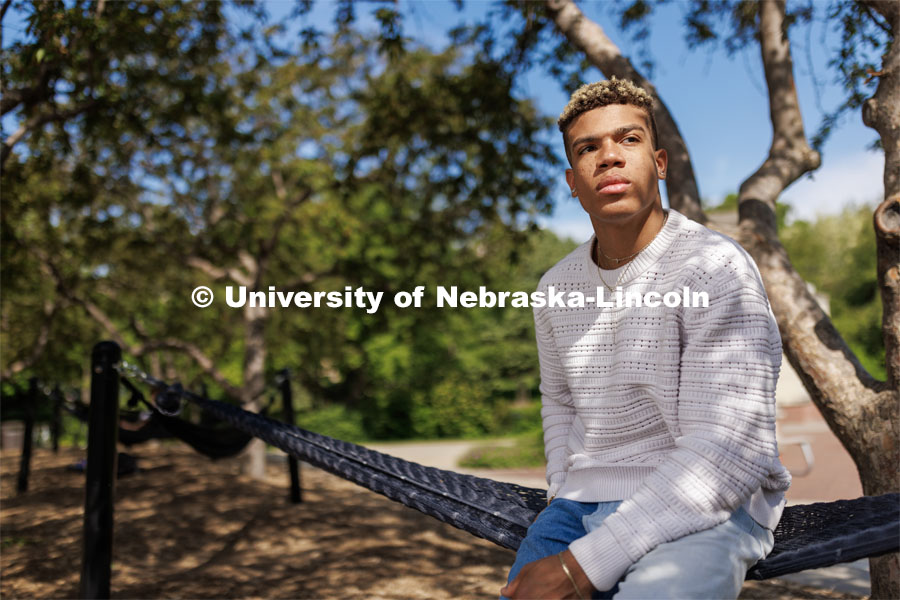 Sam Phillips, senior in Hospitality, Restaurant and Tourism Management and Husker Dialogue speaker is photographed by the hammocks outside the Nebraska Union. Husker Dialogue photo shoot. May 18, 2023. Photo by Craig Chandler / University Communication.