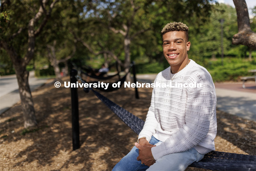 Sam Phillips, senior in Hospitality, Restaurant and Tourism Management and Husker Dialogue speaker is photographed by the hammocks outside the Nebraska Union. Husker Dialogue photo shoot. May 18, 2023. Photo by Craig Chandler / University Communication.