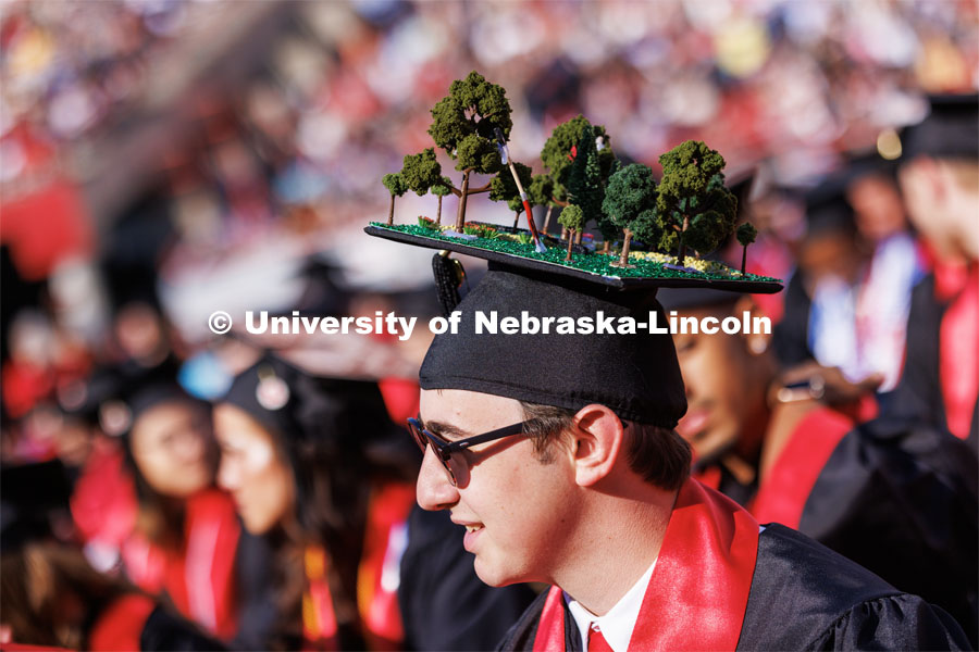 Jack Parr, Plant and Landscape Systems graduate, planted a few trees on his mortar board.  Undergraduate commencement at Memorial Stadium. May 20, 2023. Photo by Craig Chandler / University Communication.
