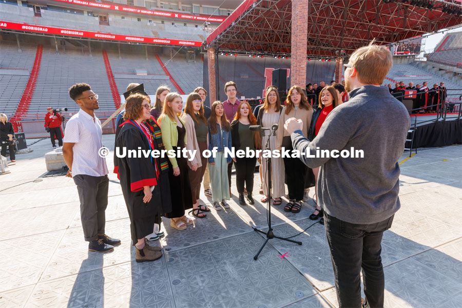 UNL Jazz Singers perform the National Anthem. Undergraduate commencement at Memorial Stadium. May 20, 2023. Photo by Craig Chandler / University Communication.