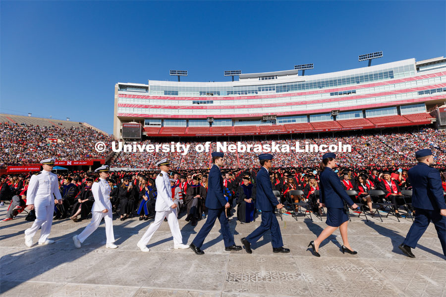 ROTC students in the Army, Air Force and Navy ROTC programs at UNL march to the stage to take their oath of office at the beginning of the ceremony. Undergraduate commencement at Memorial Stadium. May 20, 2023. Photo by Craig Chandler / University Communication.