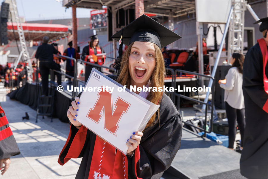 Morgan Twiss smiles for the camera. Undergraduate commencement at Memorial Stadium. May 20, 2023. Photo by Craig Chandler / University Communication.