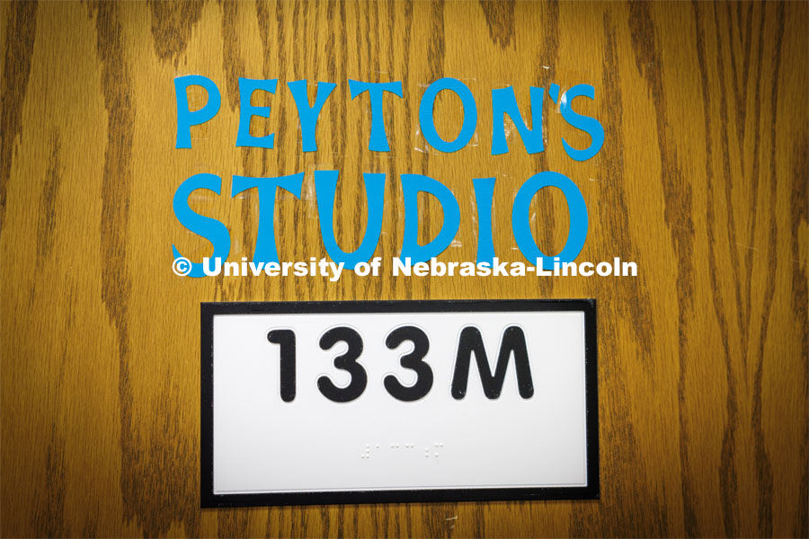 An LPS staff member named the room off the library where Peyton Miller and friends are working on a mural, “Peyton’s Studio”. Miller is a senior at Northeast High who graduated this May and has painted a mural about the FEWSS program in which UNL’s CASNR collaborates with LPS on career development. She will attend UNL in the fall pursuing an education degree. May 26, 2023. Photo by Craig Chandler / University Communication.