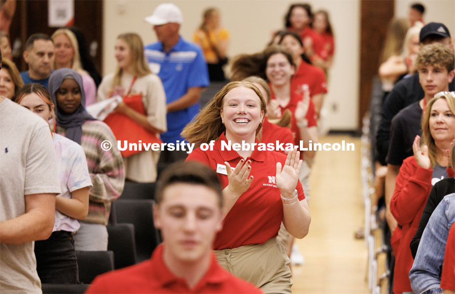 Delaney Wetjen runs to the stage with the other orientation leaders to start the day’s program. New Student Enrollment. May 30, 2023. Photo by Craig Chandler / University Communication.