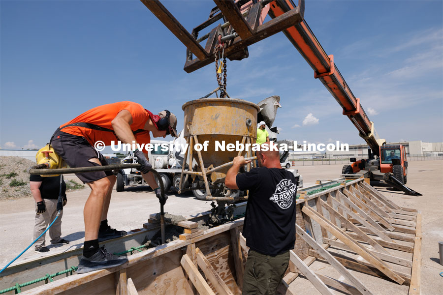 Concrete is poured into a barrier being tested at the Midwest Roadside Safety Facility for the State of Hawaii. Photo used for 2022-2023 Annual Report on Research at Nebraska. June 5, 2023. Photo by Craig Chandler / University Communication.
