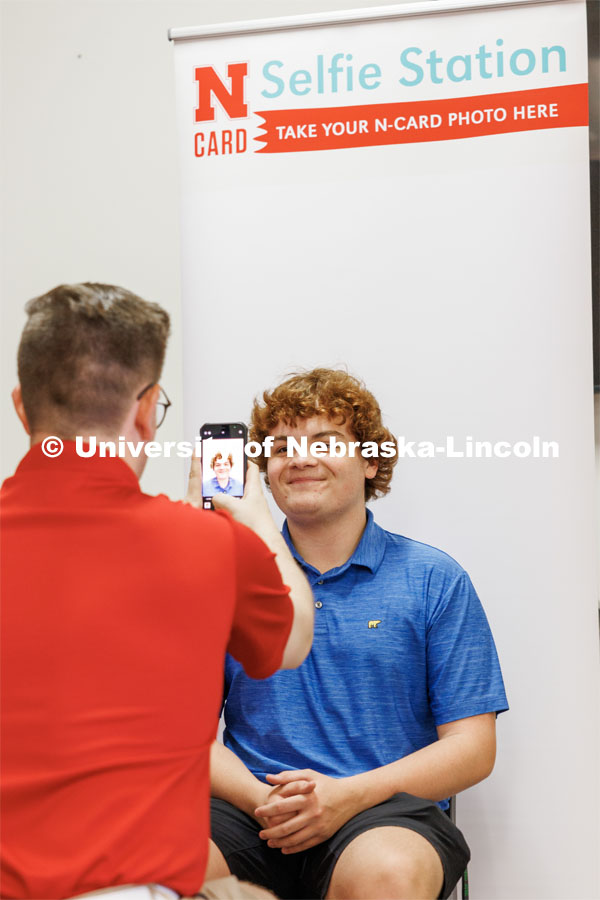 Connor Bryant, an incoming student from Omaha, has his photo taken for his N Card during New Student Enrollment. June 7, 2023. Photo by Craig Chandler / University Communication.