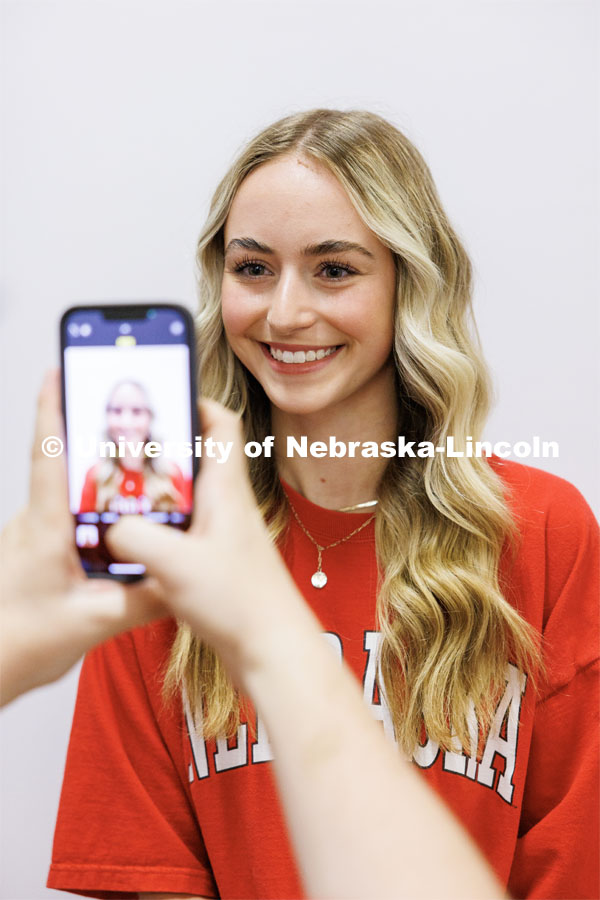 Kylie Svoboda, an incoming student from Aurora, has her photo taken for her N Card during New Student Enrollment. June 7, 2023. Photo by Craig Chandler / University Communication.