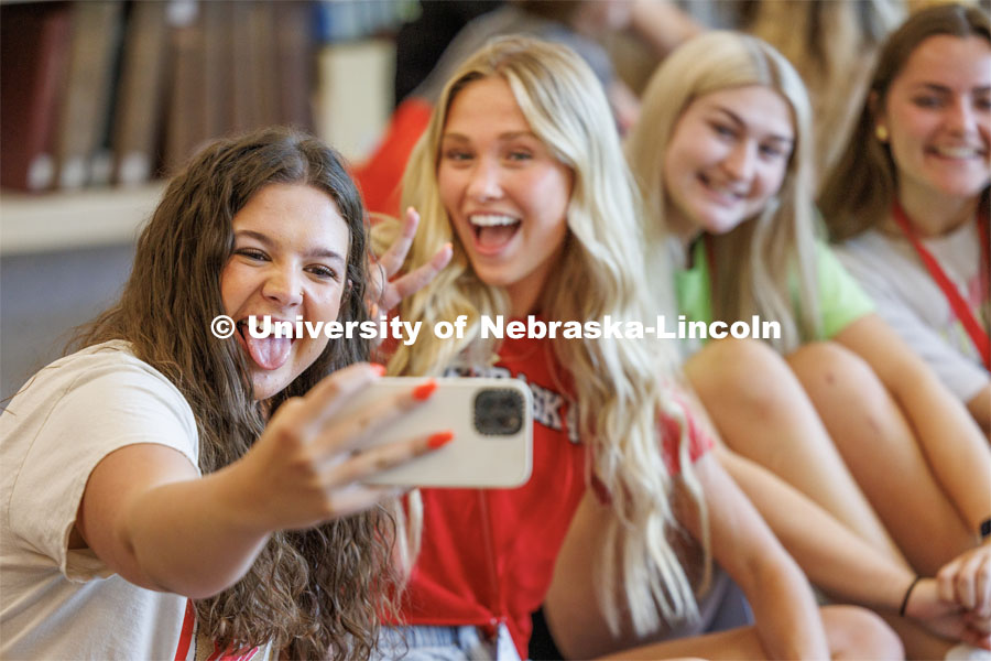 Mia Bowling of Omaha takes a selfie with her friends at New Student Enrollment. New Student Enrollment ( NSE ) on City Campus. June 13, 2023. Photo by Craig Chandler / University Communication.