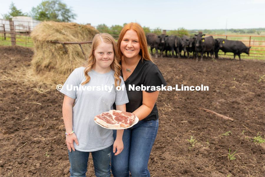 Allison Walbrecht, a freshman majoring in Animal Science, poses with Claire Bruns in a promotion photo for United Agriculture. Unified Agriculture is a beef direct to consumer dedicated to creating employment opportunities within agriculture for those disabilities. Walbrecht also created the 4-H Unified Showing Club by which a youth with a disability is paired with a buddy who helps them prepare for a lamb showing at a county fair. July 3, 2023. Credit photo by Hannah Dorn.