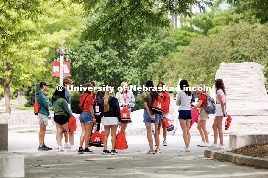 New students stand with their tour group by the Broyhill Fountain on City Campus. New Student Enrollment. July 6, 2023. Photo by Craig Chandler / University Communication. 