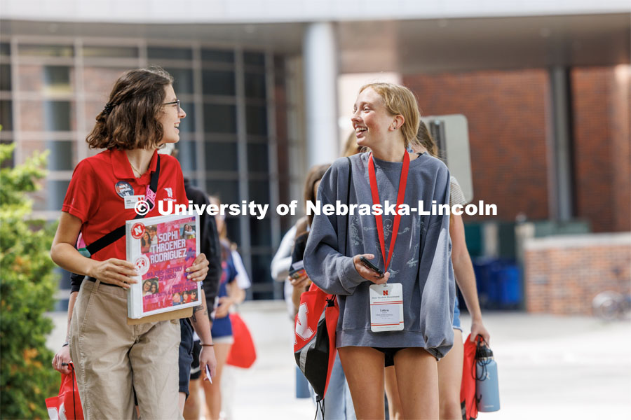 Sophi Throener Rodriguez and Laken Riekhof of Leawood, Kansas, talks as the group tours campus. New Student Enrollment. July 6, 2023. Photo by Craig Chandler / University Communication.