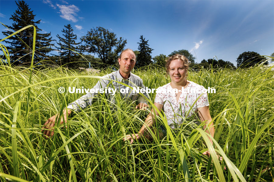 Brad Kindler and Sarah Buckley are part of projects to install native plants around the state through the Nebraska Statewide Arboretum. They stand in the east campus prairie surrounded by bluestem and switchgrass. July 12, 2023.  Photo by Craig Chandler / University Communication.