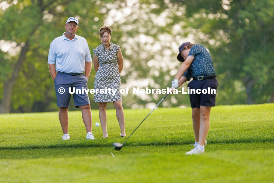 College of Agricultural Sciences and Natural Resources Dean, Tiffany Heng-Moss and her husband, Mike, watch their son, Max, practice golf. They enjoy watching their two children play golf in their spare time. Downtime with the Deans series for Alumni Magazine. July 21, 2023. Photo by Craig Chandler / University Communication.