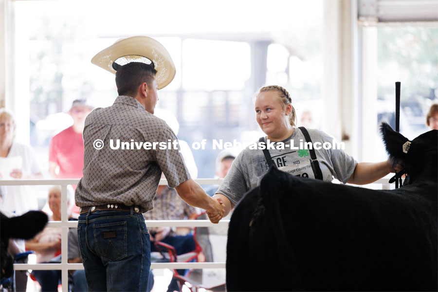 Natalie Trauernicht of Wymore accepts congratulations from the judge after winning the grand champion senior division beef showmanship competition. 4H/FFA Beef Show at the Gage County Fair and Expo in Beatrice. July 28, 2023. Photo by Craig Chandler / University Communication.