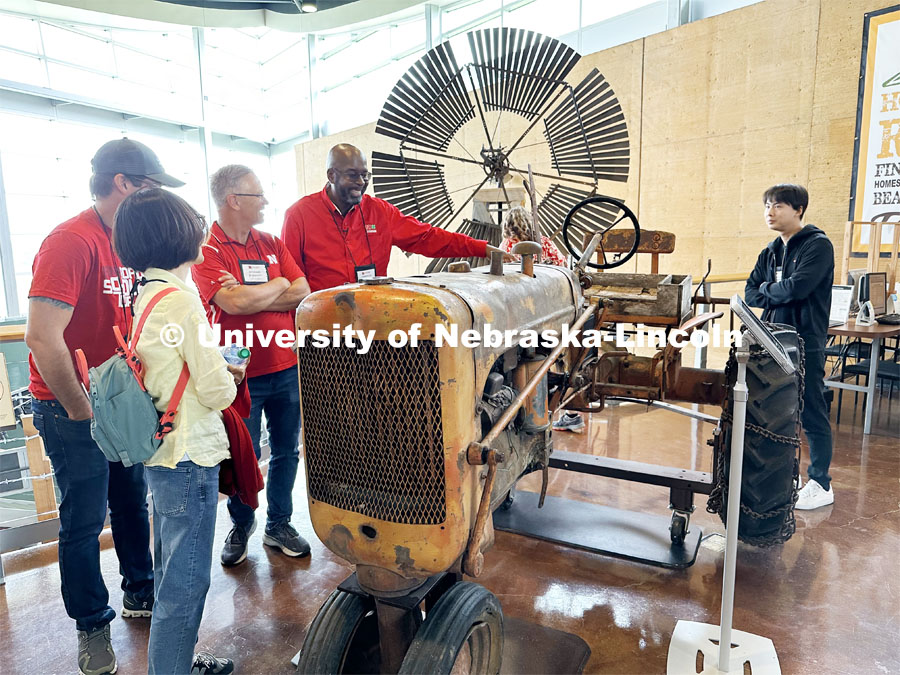 Rodney Bennett looks over a preserved tractor from the Alaskan land of the last homesteader. The tractor was preserved at the UNL Tractor Museum before it was put on display at the Homestead National Historic Park near Beatrice. IANR Roads Scholar Tour through Nebraska. August 1, 2023. Photo by Craig Chandler / University Communication.
