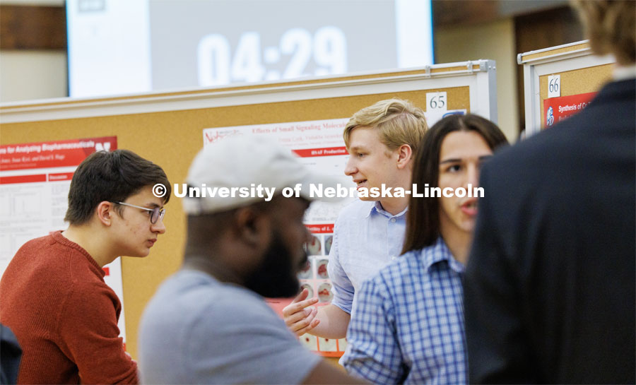 Bradley Dice of Drake discusses his chemistry research poster. Summer Undergraduate Research Fair poster session in the Nebraska Union Ballroom. August 3, 2023. Photo by Craig Chandler/ University Communication.