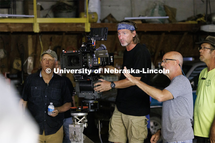 Richard Endacott talks with director of photography Barry Joyce about camera angles for the next scene. Filming of the movie using UNL students as the production crew. Richard Endacott earned multiple awards for his screenplay, "Turn Over." Story about keeping the family farm operating in the modern era as two brothers come together via restoring an old tractor to help fund their operations. August 9, 2023. Photo by Craig Chandler / University Communication.