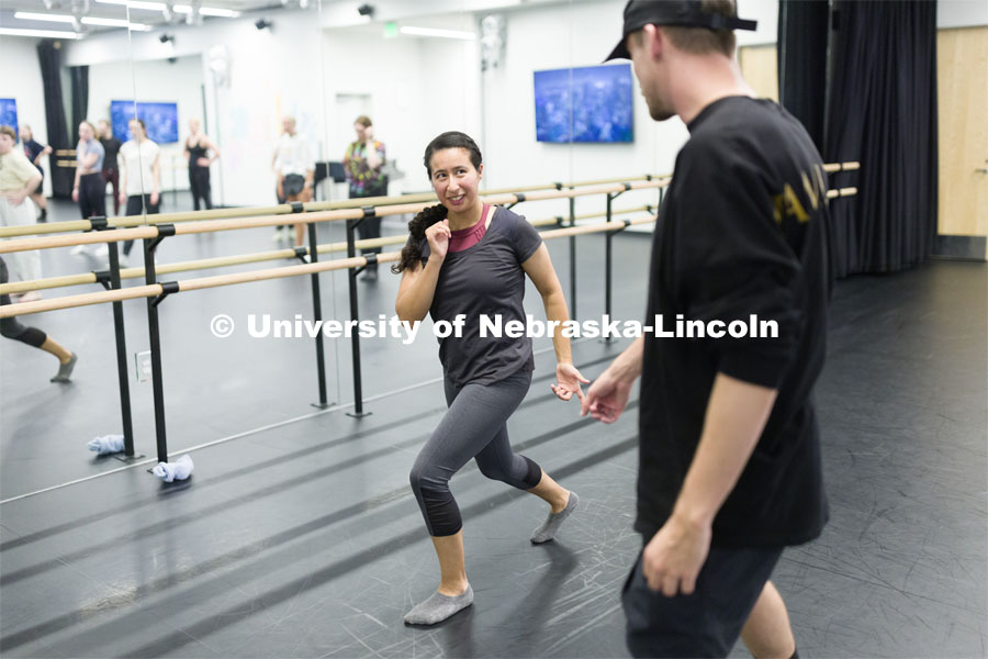 Devin Tyler Hatch, dance captain and swing, for the “Hamilton” touring company, helps Mariela Hernandez with her foot work during a master class for dance students at the Johnny Carson Center for Emerging Media Arts. August 11, 2023.  Photo by Craig Chandler/ University Communication.