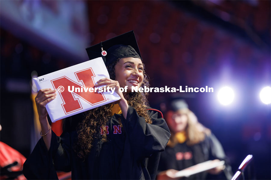Kathryn Hastings smiles at family and friends after receiving her masters degree. The University of Nebraska–Lincoln is conferring 588 degrees during the combined graduate and undergraduate commencement ceremony at Pinnacle Bank Arena. August 12, 2023. Photo by Craig Chandler/ University Communication.