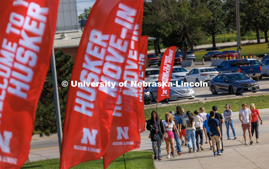 Students, friends and family walk into Devaney Sports Center to start the move-in process. First day of residence hall move-in. August 14, 2023. Photo by Craig Chandler/ University Communication.