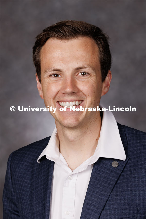 Studio portrait of Michael Ricks, Assistant Professor of Economics. 2023 New Faculty Orientation. August 16, 2023. Photo by Craig Chandler / University Communication.