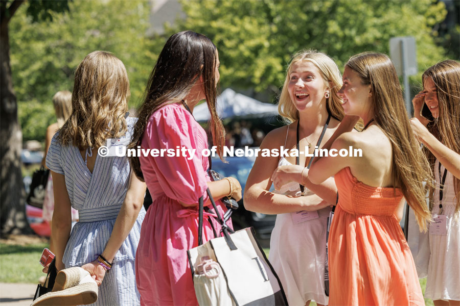 Elliot Brown talks with friends in between events during the Sorority Recruitment Philanthropy Round. August 16, 2023. Photo by Craig Chandler/ University Communication.