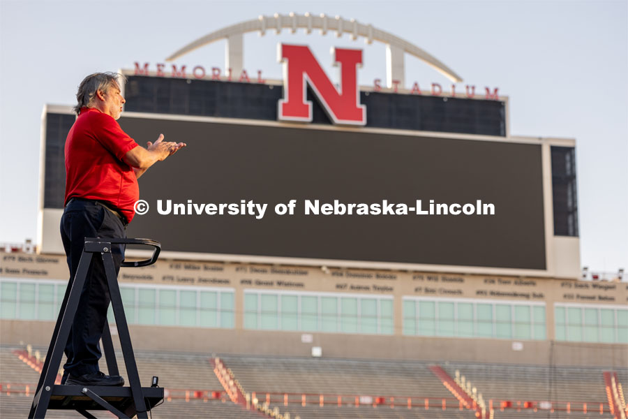 Director of the Cornhusker Marching Band, Anthony Falcone, stands high on the ladder overlooking the band. Big Red Welcome week featured the Cornhusker Marching Band Exhibition in Memorial Stadium where they showed highlights of what the band has been working on during their pre-season Band Camp, including their famous “drill down”. August 18, 2023. Photo by Sammy Smith / University Communication.