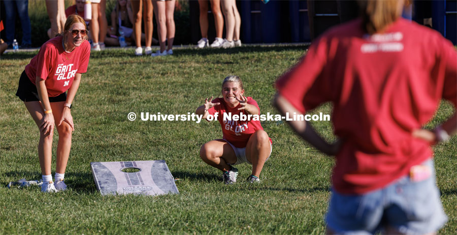 Maddy Tubrick of Omaha can’t believe her toss went so badly as she and Brooklyn Hardie of Sioux City, Iowa compete in corn hole. Chancellor’s BBQ in the green space between the Nebraska Union and Kauffmann Academic Residence Center. August 18, 2023. Photo by Matthew Strasburger / University Communication.
