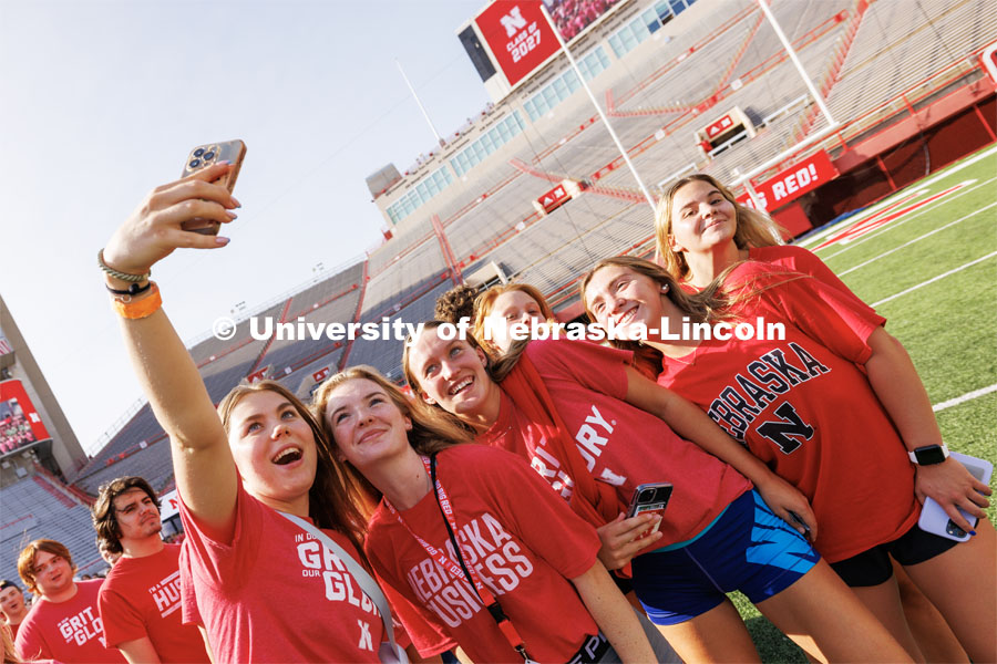 Students pose for a selfie at the Tunnel Walk in Memorial Stadium. August 18, 2023. Photo by Craig Chandler / University Communication.