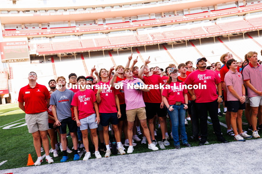 The class of 2027 gather on the field to form and "N" at the Tunnel Walk in Memorial Stadium. August 18, 2023. Photo by Craig Chandler / University Communication.