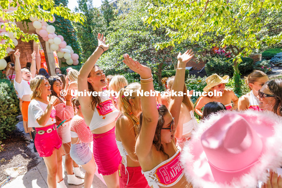 New recruits run through the gauntlet of their new Alpha Xi sorority sisters. Sorority Bid Day in the Cather Dining Complex and on the Vine Street Fields. August 19, 2023. Photo by Craig Chandler / University Communication.