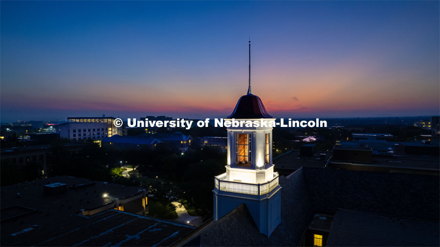 The cupola on Love Library glows at dawn as the sun rises on the First day of classes of fall semester. August 21, 2023 Photo by Craig Chandler / University Communication. 