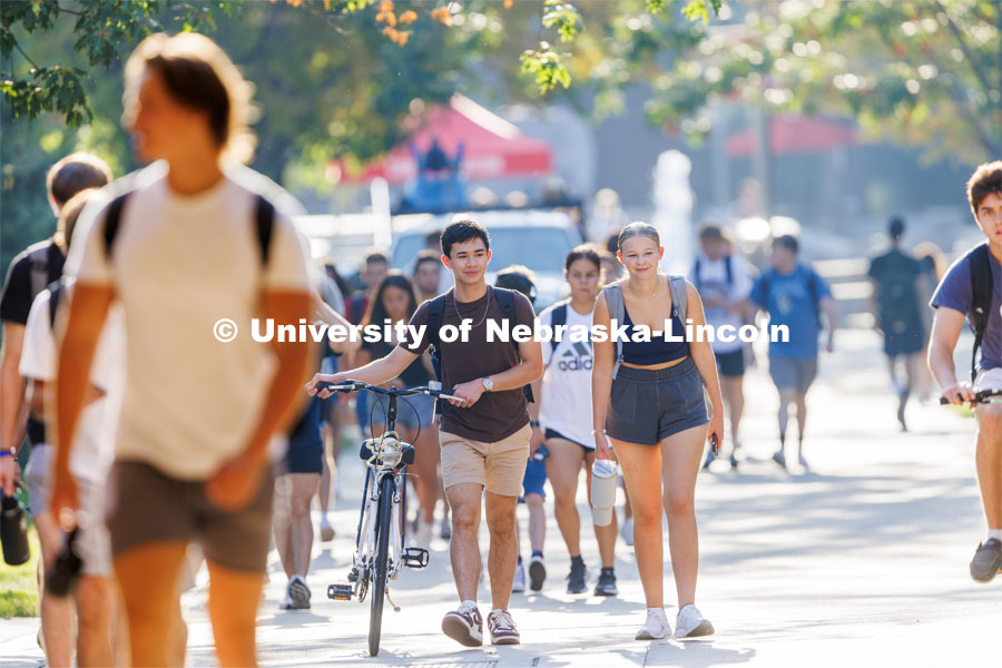 Wyatt Schnase and Kylie Ray, both freshman from Lincoln, walk to class on the first day of classes for fall semester. August 21, 2023. Photo by Craig Chandler / University Communication.