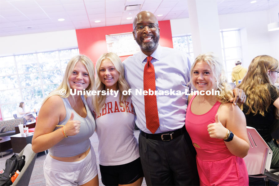 Chancellor Rodney Bennett poses for photos with students during the chancellor’s cookie give-away Monday morning. First day of classes for fall semester. August 21, 2023. Photo by Craig Chandler / University Communication.