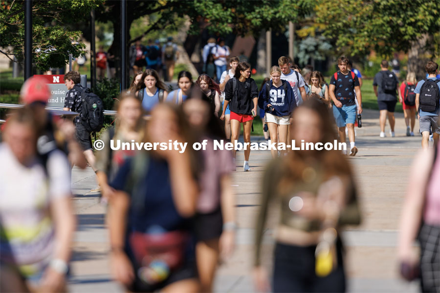 Freshman Julianne Feddema and Brielle Schwartz, both from Minnesota, walk through campus after their 9:30 a.m. class. Students pass between classes on city campus. August 29, 2023. Photo by Craig Chandler/ University Communication.