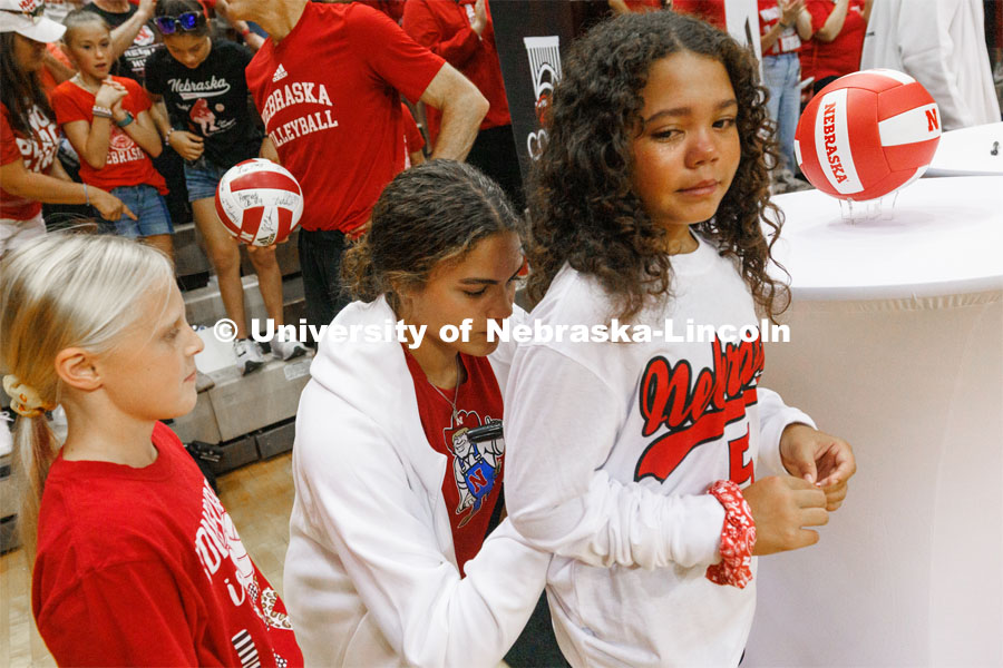 Bekka Allick signs the jersey of Neveah Kehr, 10, from Bismarck, North Dakota, after Neveah and another young girl were selected to read their hand-written notes to the Nebraska Volleyball team. Bekka is Neveah’s favorite player. Rally at the Coliseum. Volleyball Day in Nebraska. Husker Nation stole the show on Volleyball Day in Nebraska. The announced crowd of 92,003 surpassed the previous world record crowd for a women’s sporting event of 91,648 fans at a 2022 soccer match between Barcelona and Wolfsburg. Nebraska also drew the largest crowd in the 100-year history of Memorial Stadium for Wednesday’s match. August 30, 2023. Photo by Craig Chandler / University Communication.