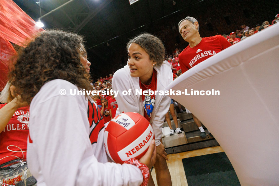 Bekka Allick talks with Neveah Kehr, 10, from Bismarck, North Dakota, after Neveah and another young girl were selected to read their hand-written notes to the Nebraska Volleyball team. Bekka is Neveah’s favorite player. Rally at the Coliseum. Volleyball Day in Nebraska. Husker Nation stole the show on Volleyball Day in Nebraska. The announced crowd of 92,003 surpassed the previous world record crowd for a women’s sporting event of 91,648 fans at a 2022 soccer match between Barcelona and Wolfsburg. Nebraska also drew the largest crowd in the 100-year history of Memorial Stadium for Wednesday’s match. August 30, 2023. Photo by Craig Chandler / University Communication.
