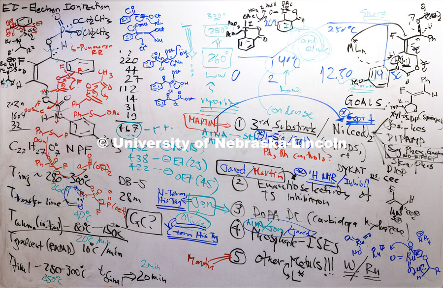 A white board is a central place for working out problems in the chemistry offices in Hamilton Hall. August 31, 2023. Photo by Craig Chandler / University Communication.