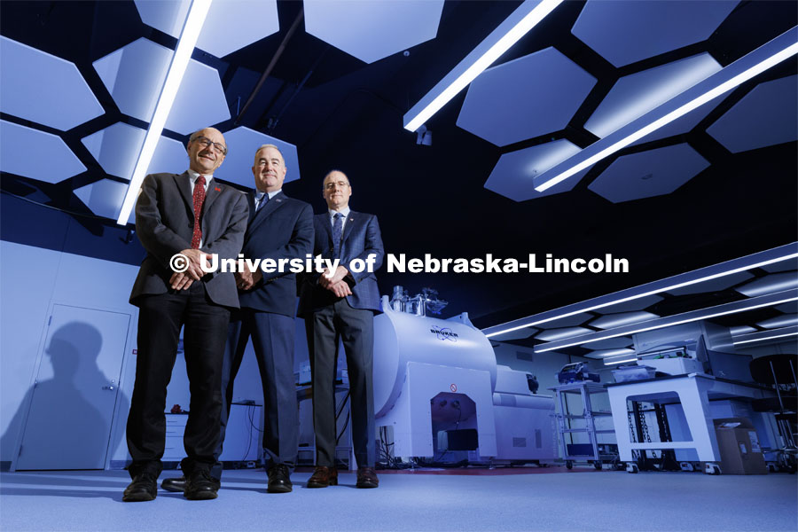(From left) David Berkowitz of the University of Nebraska–Lincoln, Rick Evans of the National Strategic Research Institute and Ken Bayles of the University of Nebraska Medical Center have received a $24.5 million award from the Defense Health Agency to advance development of an acute radiation syndrome prophylactic. They are shown with UNL’s new 15-Tesla ICR-MS instrument in Hamilton Hall. August 31, 2023. Photo by Craig Chandler / University Communication.