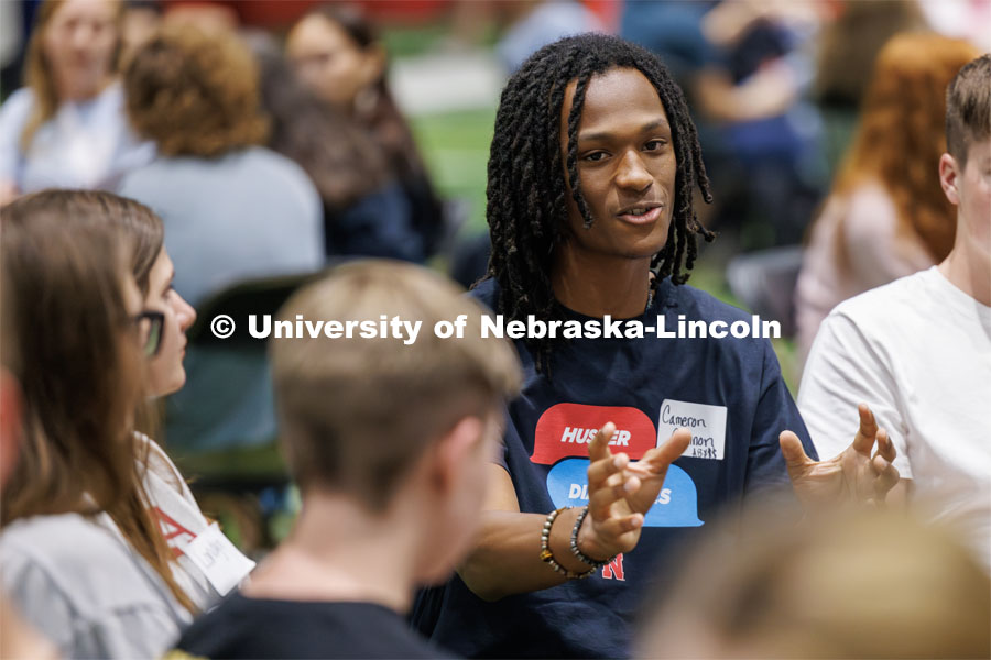 Cameron Cannon leads a discussion circle. Students sit in discussion circles during Husker Dialogues in the Coliseum and Cook Pavilion. September 6, 2023. Photo by Craig Chandler / University Communication.