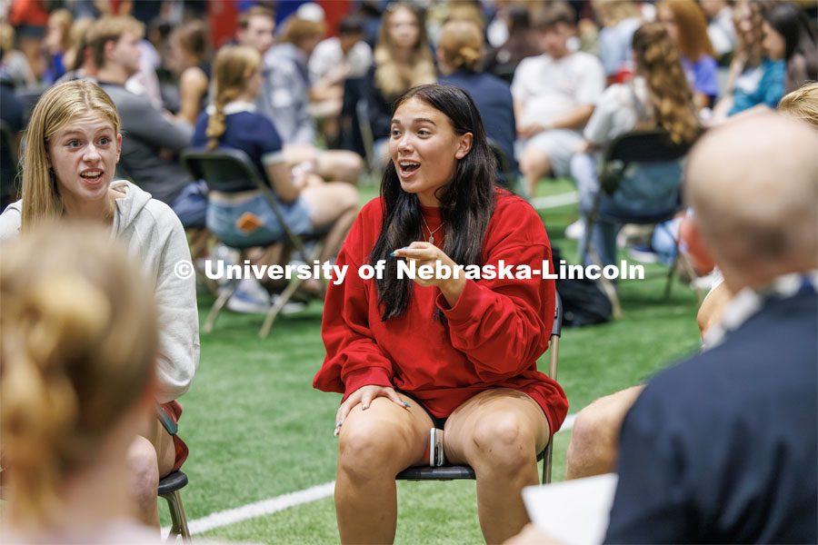 An expressive Bailey Ostlund of Omaha talks during a discussion on the best way of taking notes during class. Students sit in discussion circles during Husker Dialogues in the Coliseum and Cook Pavilion. September 6, 2023. Photo by Craig Chandler / University Communication.