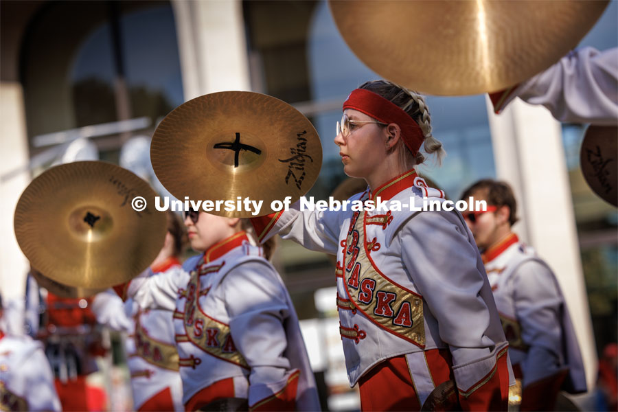 Skyler Krull performs with the cymbals during the battery percussion warm-up on Sheldon Museum of Art west steps. Northern Illinois football in Memorial Stadium. September 16, 2023. Photo by Craig Chandler / University Communication.