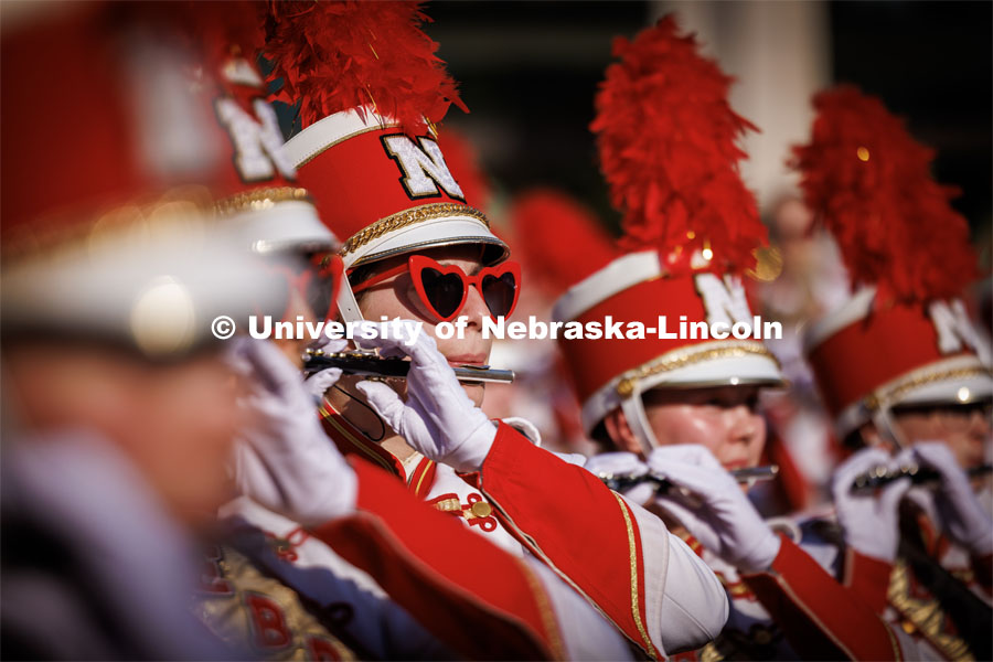 Annie Von Kampen wears her heart-shaped sunglasses as she and the piccolo section play during the Cornhusker Marching Band warm-up concert on the south side of Woods Art Building. Northern Illinois football in Memorial Stadium. September 16, 2023. Photo by Craig Chandler / University Communication.